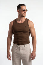 [Chocolate] Man wearing a brown tank top and beige pants on a white background