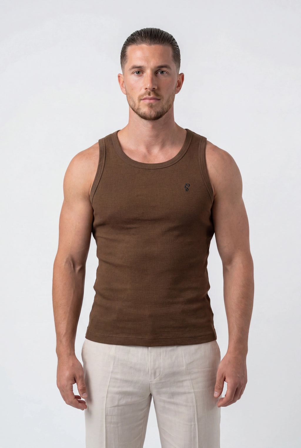 [Chocolate] Man wearing a brown tank top and white pants on a white background
