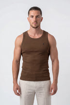 [Chocolate] Man wearing a brown tank top and white pants on a white background