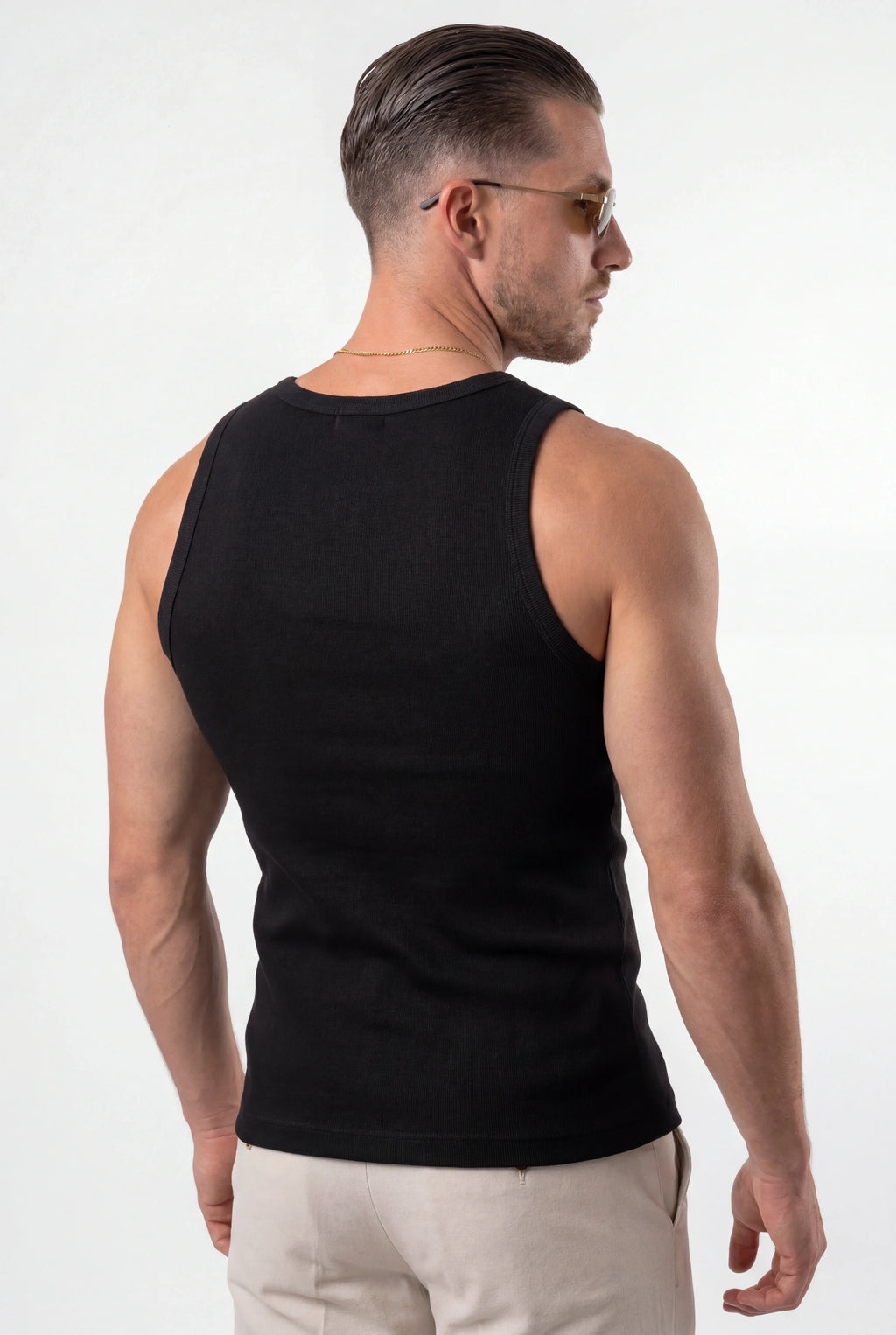 [Black] Man wearing a black tank top on a white background